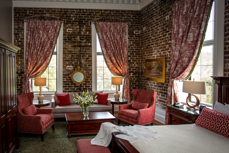 Original real brick walls in a corner suite at East Bay Inn in Savannah
